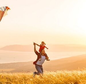 Father and daughter with a kite.