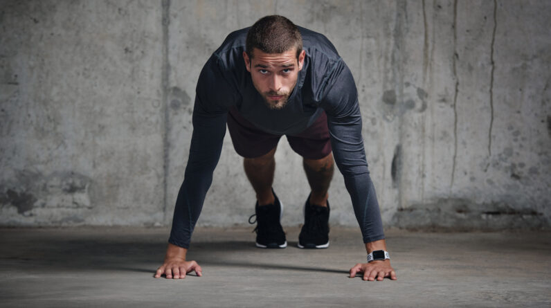 The Benefits of a CrossFit Wall Walk—And How To Perform It Properly