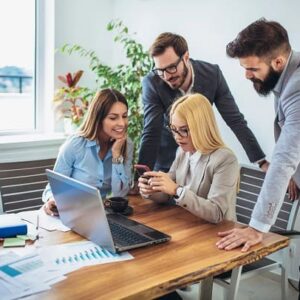 Co-workers looking at a woman