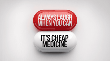 Two medical pills that say that laughter is a cheap medicine.