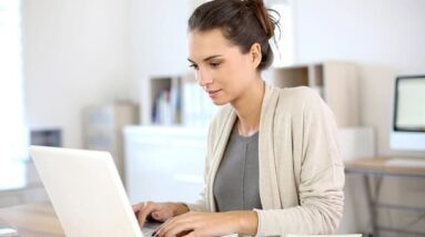 A woman working hard at her laptop.