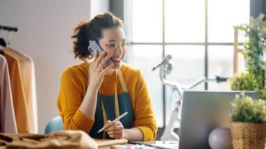 A female small business owner talking on the phone.