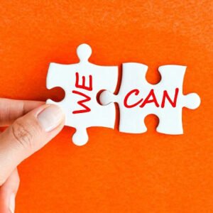 A and holding puzzle pieces that say: WE CAN.