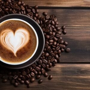 A cup of coffee with a white heart in the foam and coffee beans strewn around the cup.