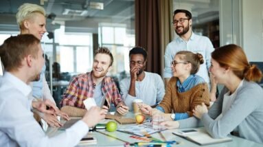 A team in a good mood at a meeting at work.