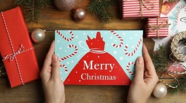 A Christmas card and Christmas decorations.