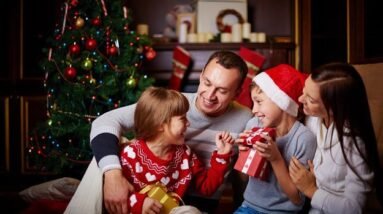 A family with Christmas gifts.