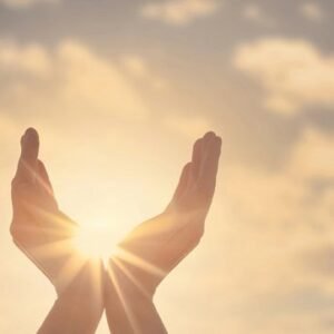 Two hands reaching towards the sky with the sun in the background.