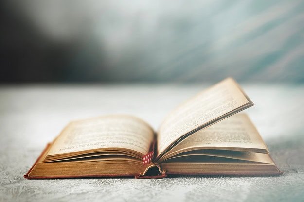 An open, older book.